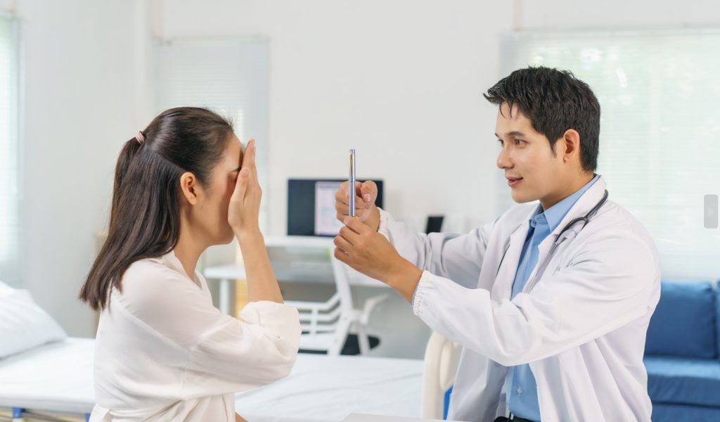 doctor-examining-patient-eyesight-covering-one-eye-2025-10-08-13-02-03-utc